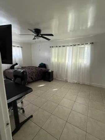 a room with furniture and a flat screen tv
