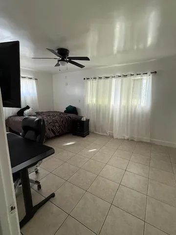 a room with furniture and a flat screen tv