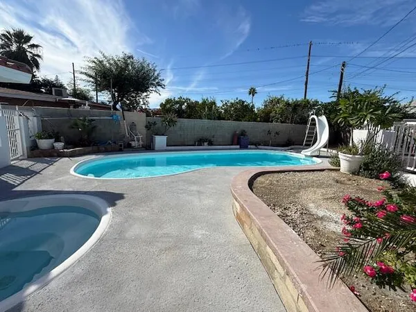 a view of a garden with a slide
