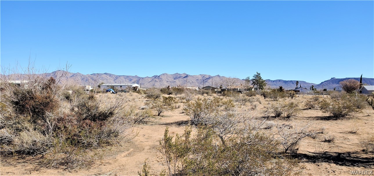 0 North Verde Road Golden Valley, AZ 86413 - Photo 5 of 16 a view of a dry field with mountains in the background