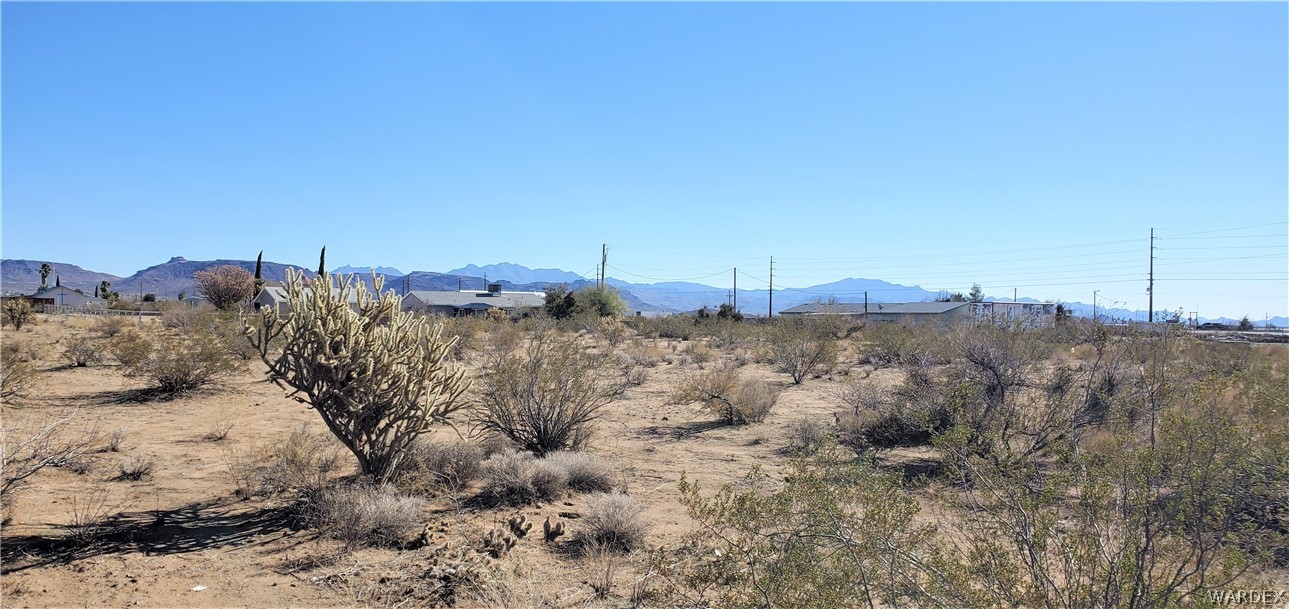 0 North Verde Road Golden Valley, AZ 86413 - Photo 7 of 16 a view of a dry yard with a house in the background