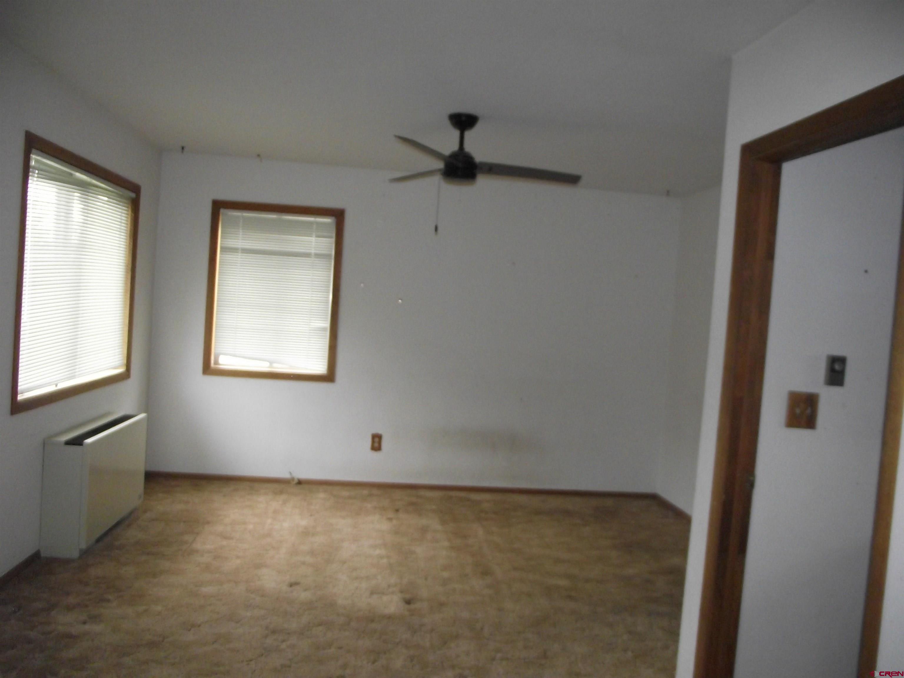42996 Needle Rock Road Crawford, CO 81415 - Photo 26 of 45 an empty room with windows