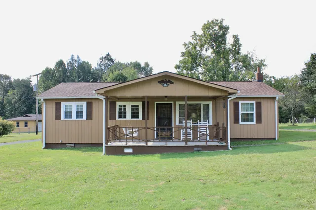 front view of a house with a yard