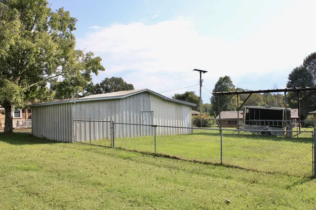a view of a backyard with couches