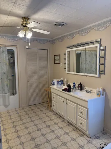 a kitchen with stainless steel appliances a stove refrigerator and cabinets