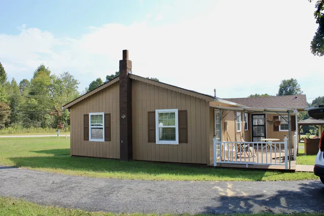 a front view of a house with garden