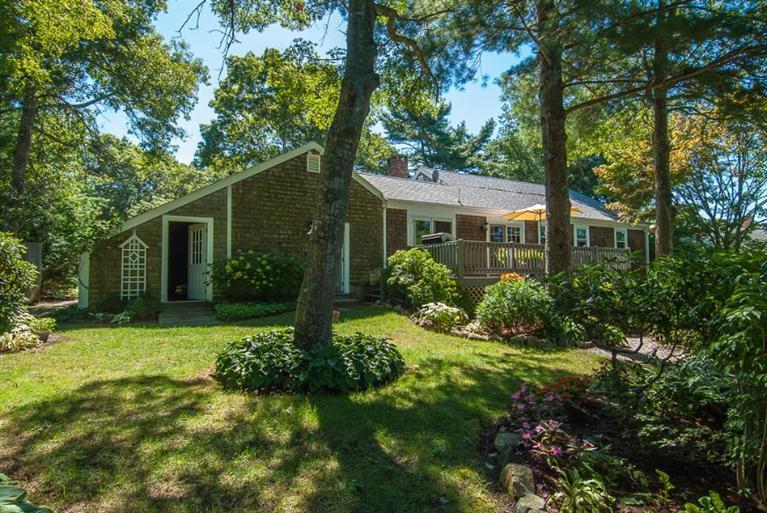 86 Oldham Road Osterville, MA 02655 - Photo 29 of 30 a front view of a house with a yard and trees