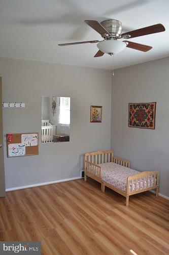 5953 Kedron Street Springfield, VA 22150 - Photo 12 of 28 a view of a livingroom with a couch