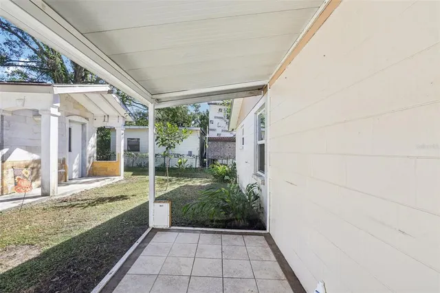 a bathroom with a tub and window