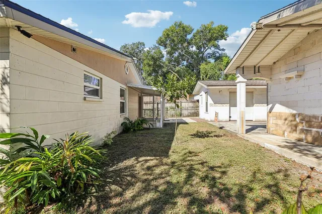 a house view with a backyard space