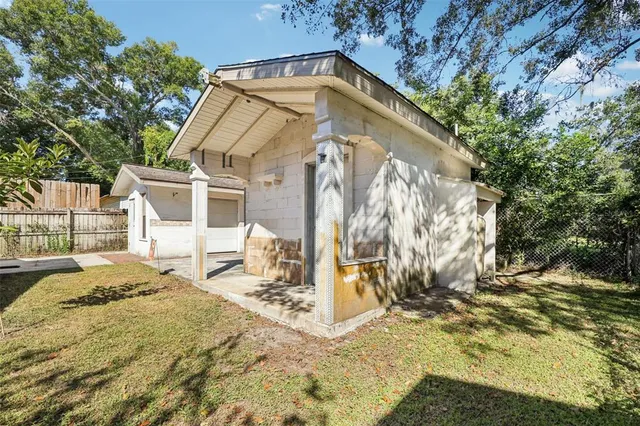 a view of a house with snow on the background