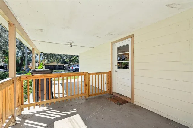 a view of a balcony with wooden floor