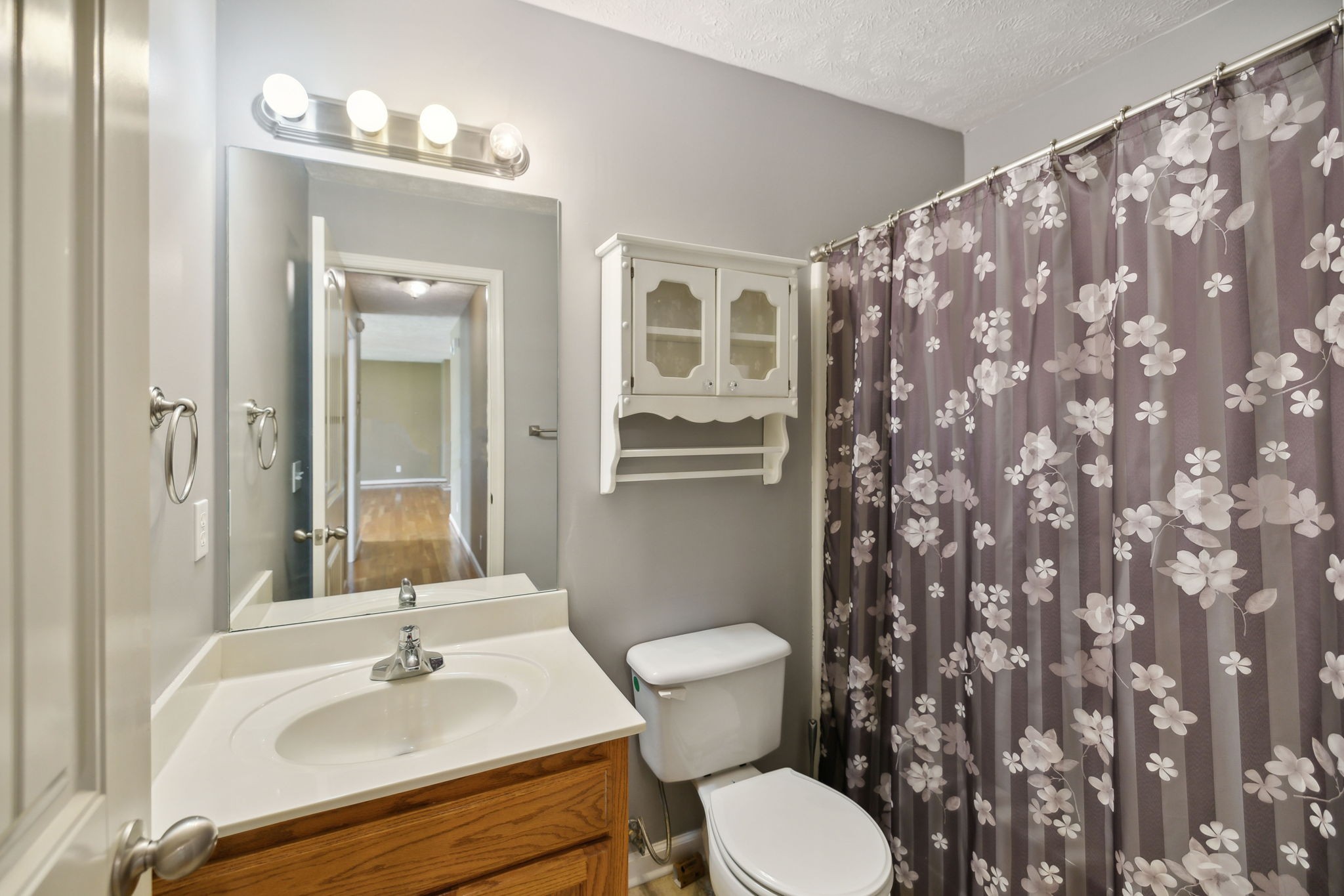 373 Oak Hollow Road Manchester, TN 37355 - Photo 20 of 34 a bathroom with a sink and mirror with toilet