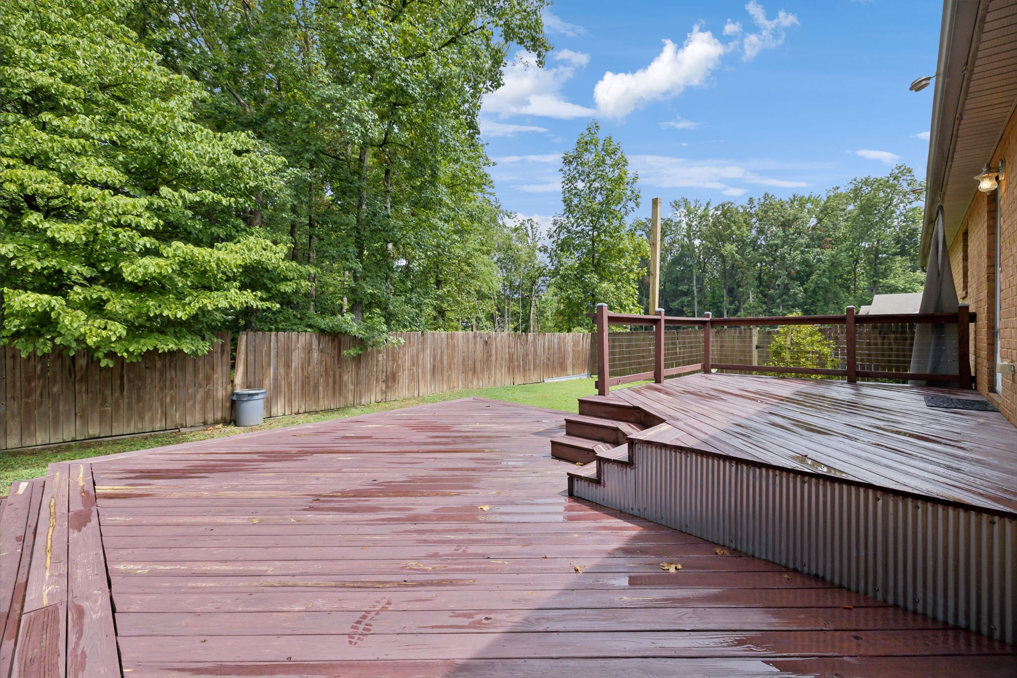 373 Oak Hollow Road Manchester, TN 37355 - Photo 23 of 34 a view of a wooden deck with a bench