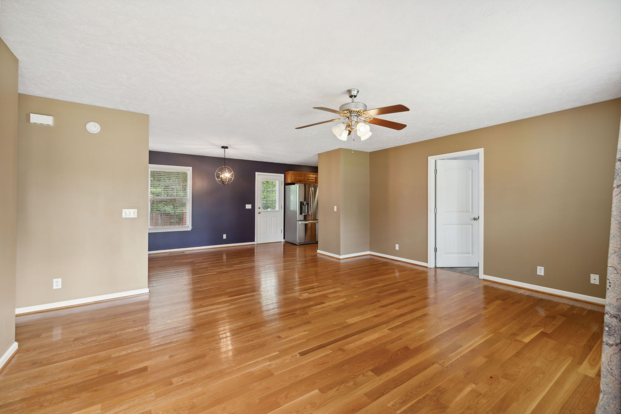 373 Oak Hollow Road Manchester, TN 37355 - Photo 4 of 34 a view of an empty room with window and wooden floor