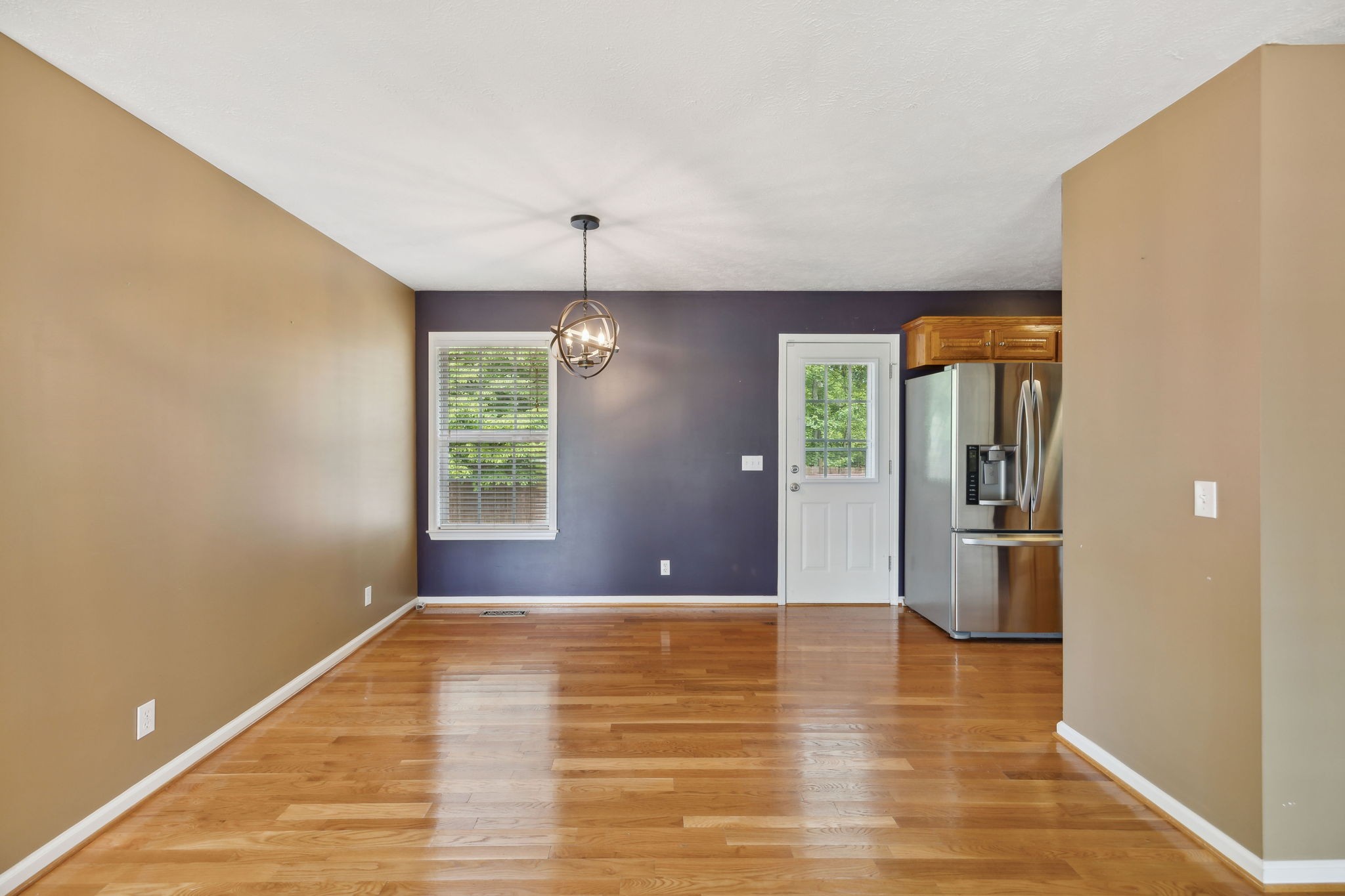 373 Oak Hollow Road Manchester, TN 37355 - Photo 7 of 34 a view of empty room with wooden floor and fan