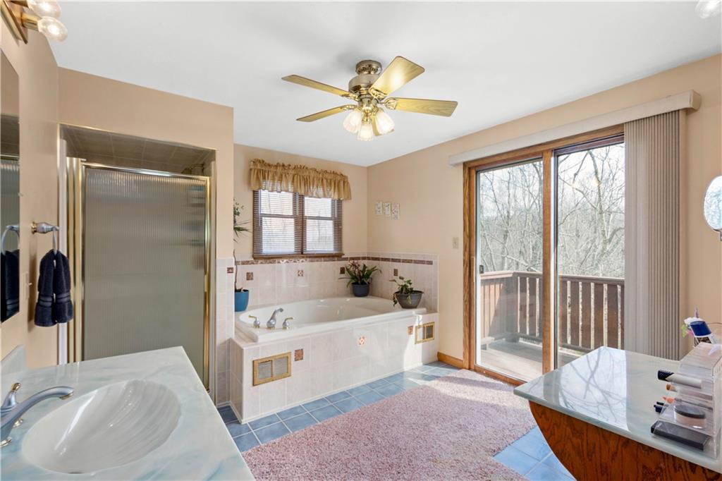 105 Deer Run Road Washington, PA 15301 - Photo 16 of 25 Five piece spa like owners bath with a large soaking tub, walk in shower, makeup vanity and a beautiful private balcony.