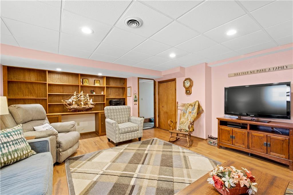 105 Deer Run Road Washington, PA 15301 - Photo 21 of 25 The impressive game room has an entire wall full of stunning built in bookshelves!