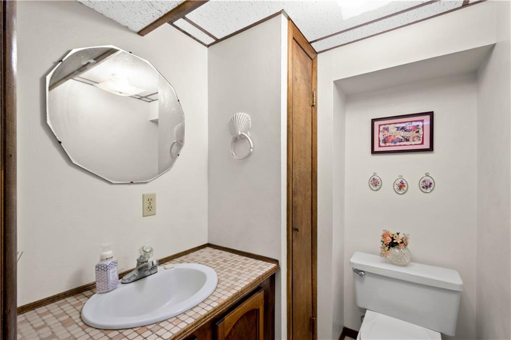 105 Deer Run Road Washington, PA 15301 - Photo 23 of 25 The lower level half bath with a linen closet for storage.