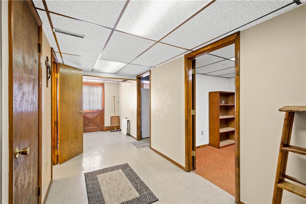 105 Deer Run Road Washington, PA 15301 - Photo 25 of 25 Mud room space in the walk out LL. Office, Half bath and laundry room with access to both integral garages and the heated workshop as well.