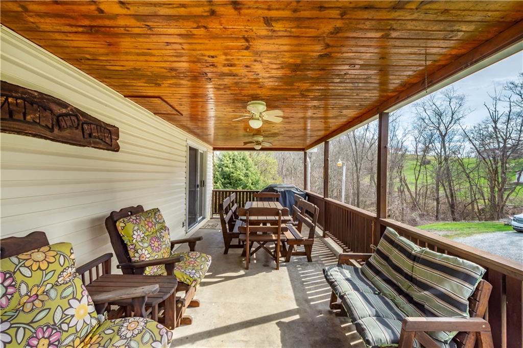 105 Deer Run Road Washington, PA 15301 - Photo 7 of 25 Enjoy warm summer nights on the huge covered porch!