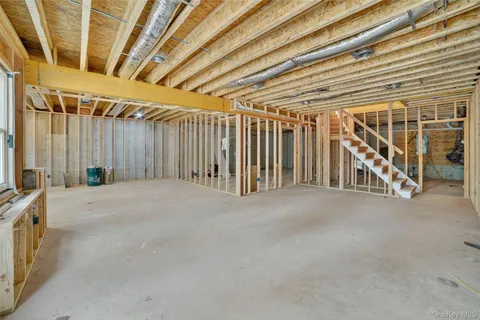 a view of swimming pool with lawn chairs and trees