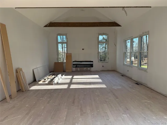 a living room with furniture a window and fireplace
