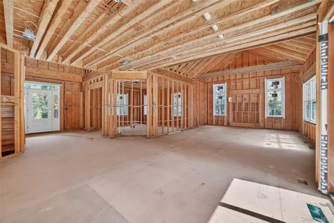 a view of an empty room with a fireplace