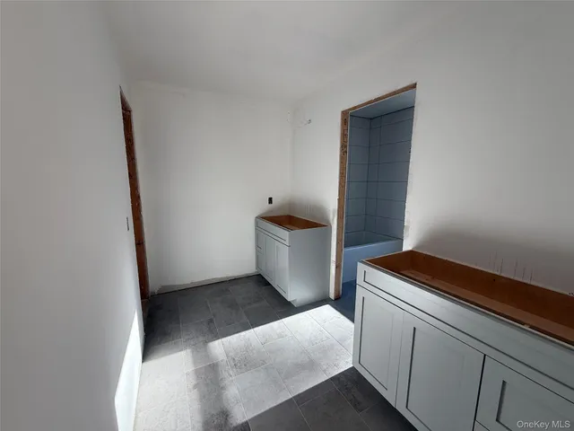 a view of an empty room with a balcony