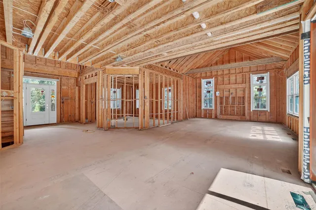 a view of an empty room with windows