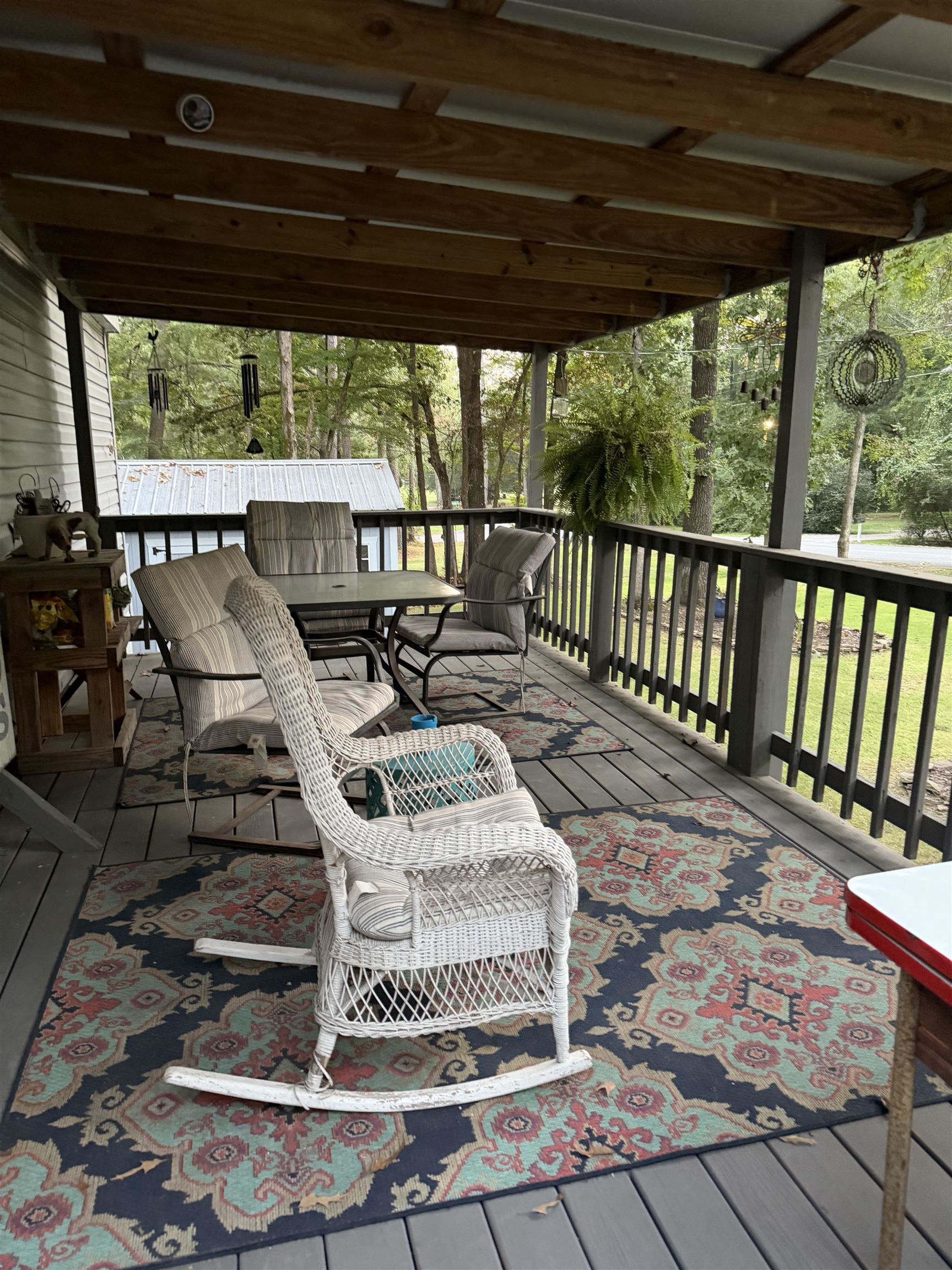 185 Pine Tree Road Moscow, TN 38057 - Photo 1 of 36 Covered porch with wood-finish ceiling, wood decking, and a railing with vertical balusters