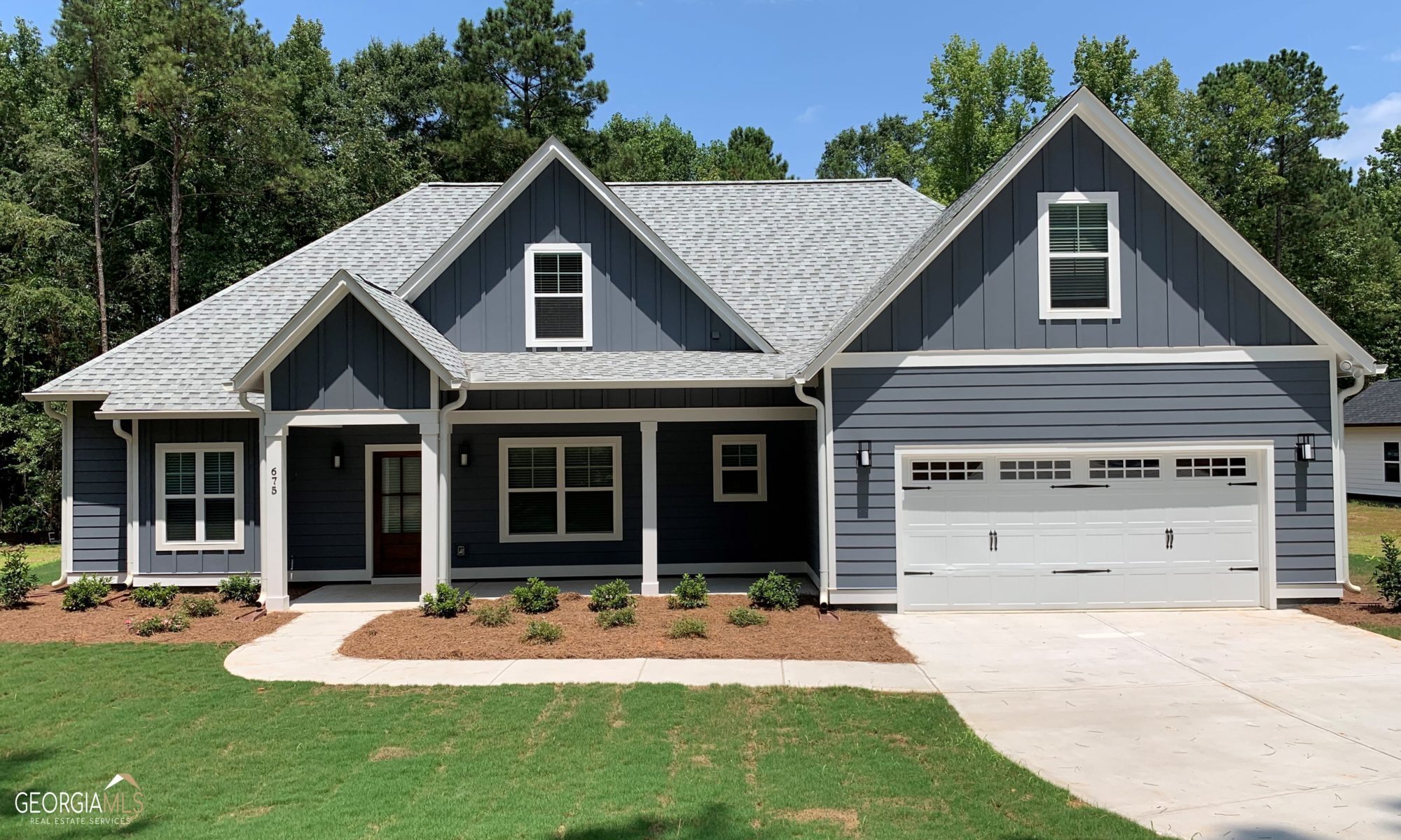 384 Old Airport Road Commerce, GA 30530 - Photo 1 of 1 a front view of a house with garden