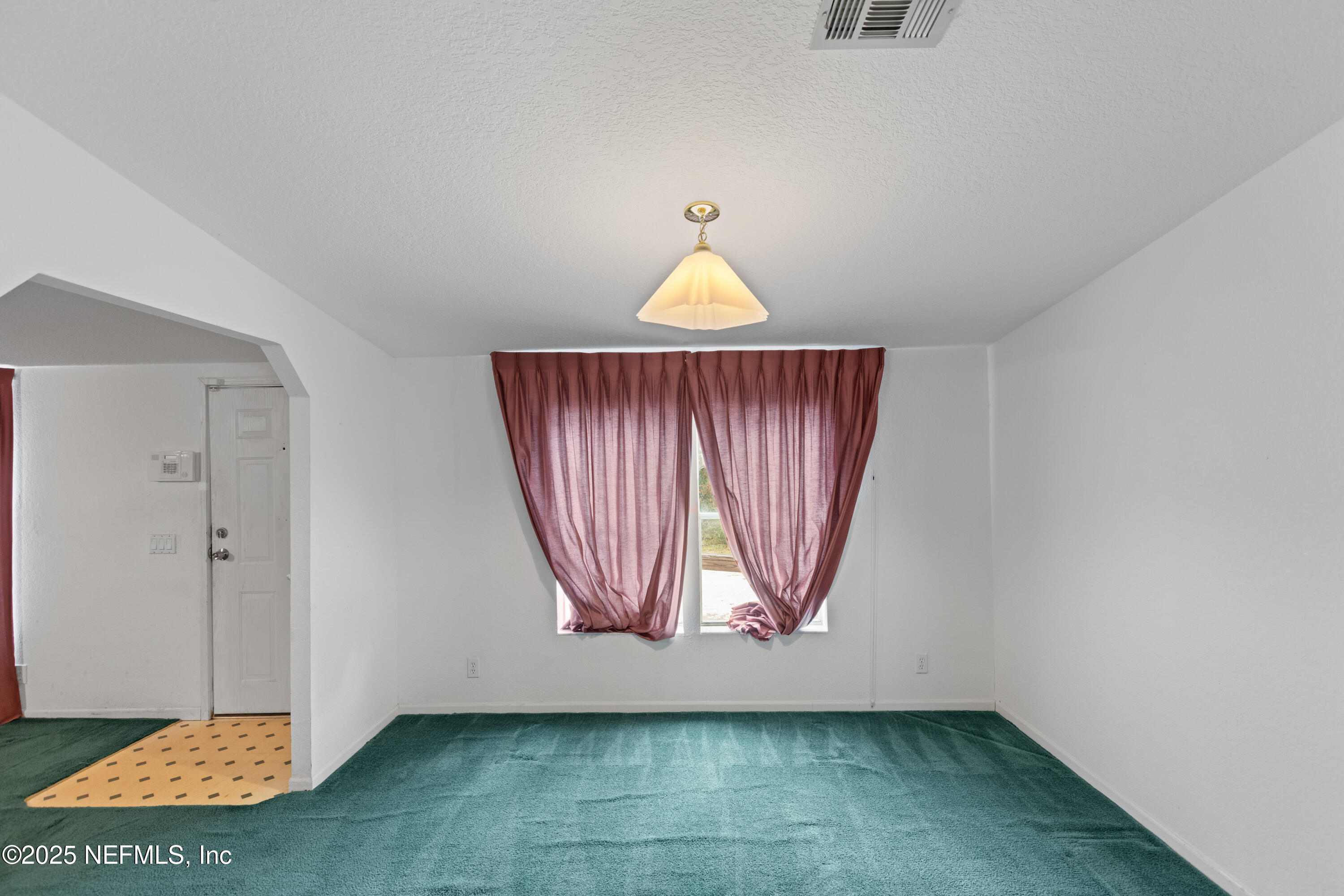 5750 Sequoia Road Keystone Heights, FL 32656 - Photo 17 of 33 an empty room with windows