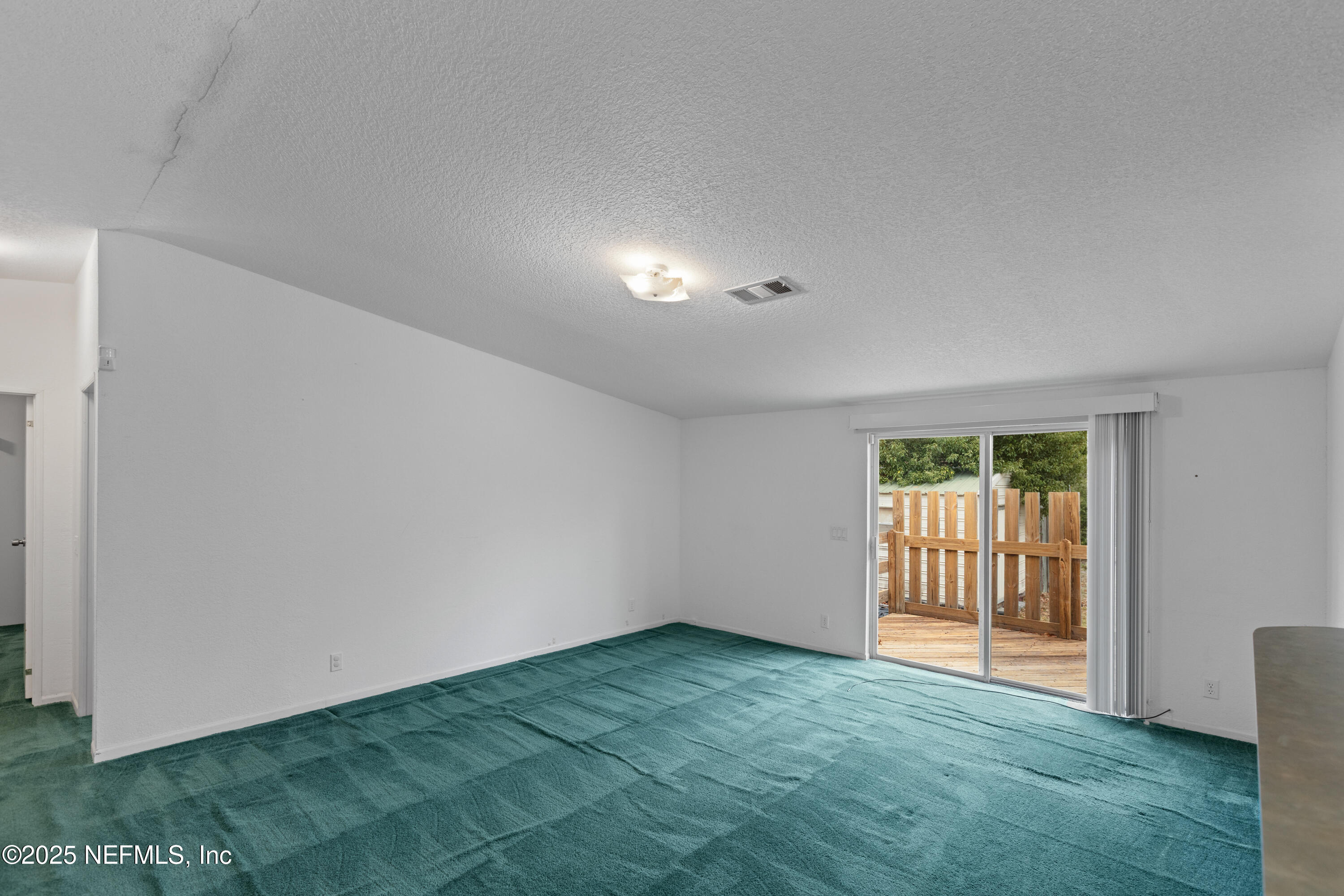 5750 Sequoia Road Keystone Heights, FL 32656 - Photo 24 of 33 an empty room with windows