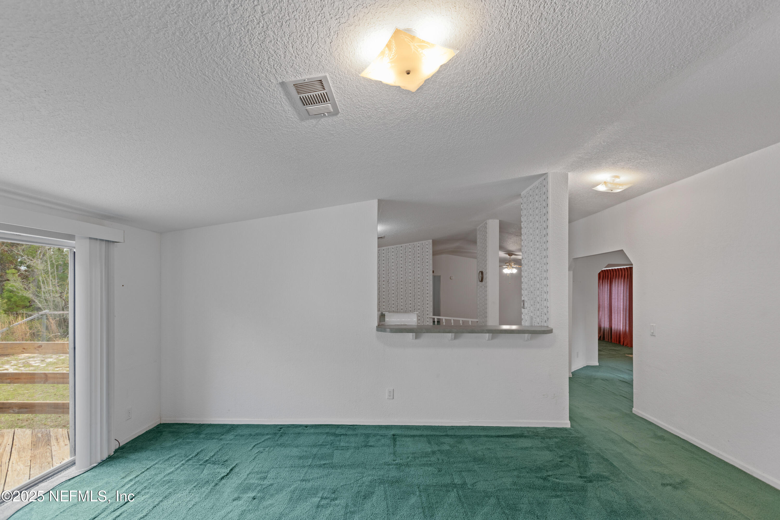 5750 Sequoia Road Keystone Heights, FL 32656 - Photo 25 of 33 a view of a kitchen with wooden floor and a window