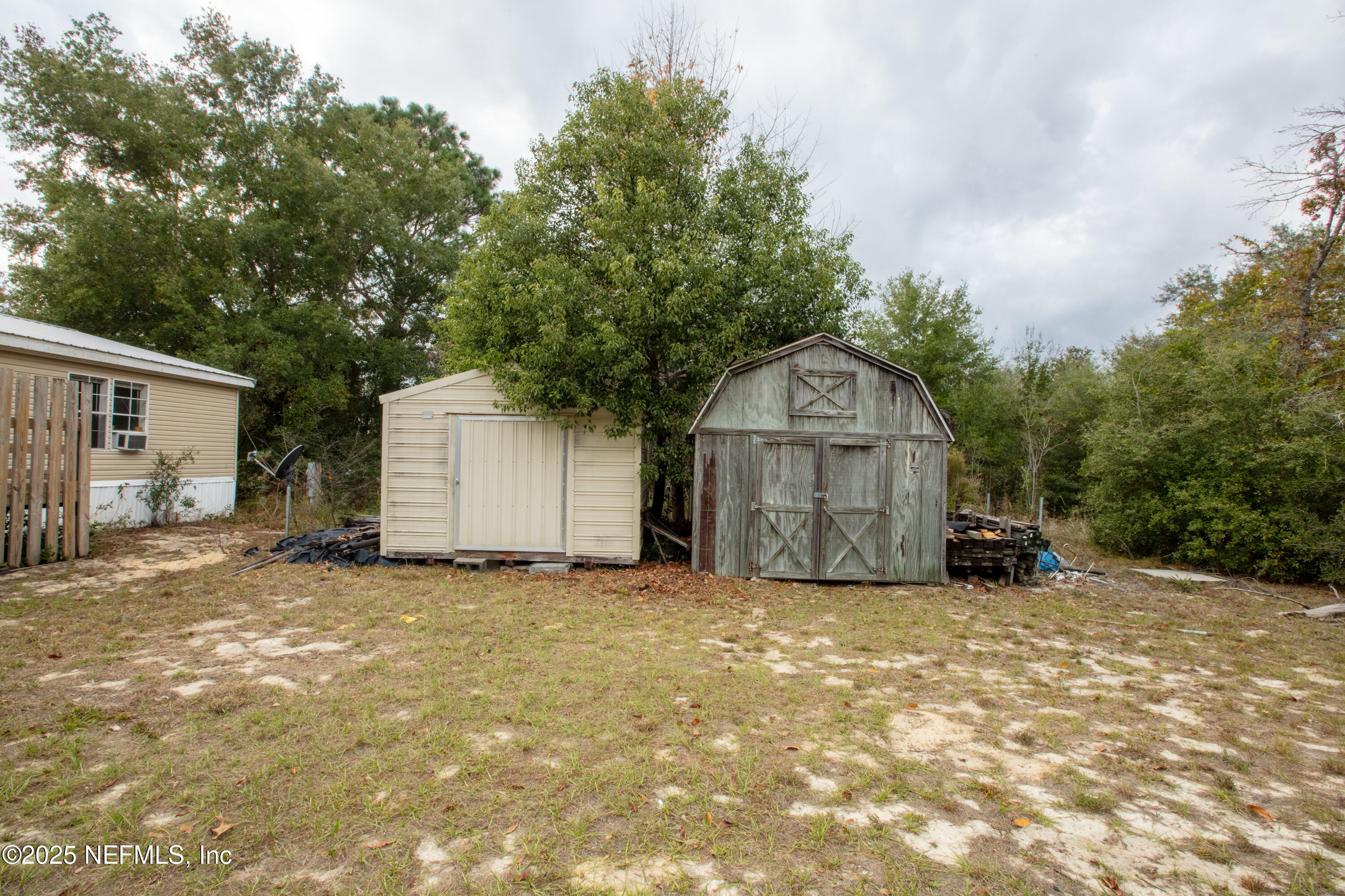 5750 Sequoia Road Keystone Heights, FL 32656 - Photo 6 of 33 a view of a house with a yard and large tree
