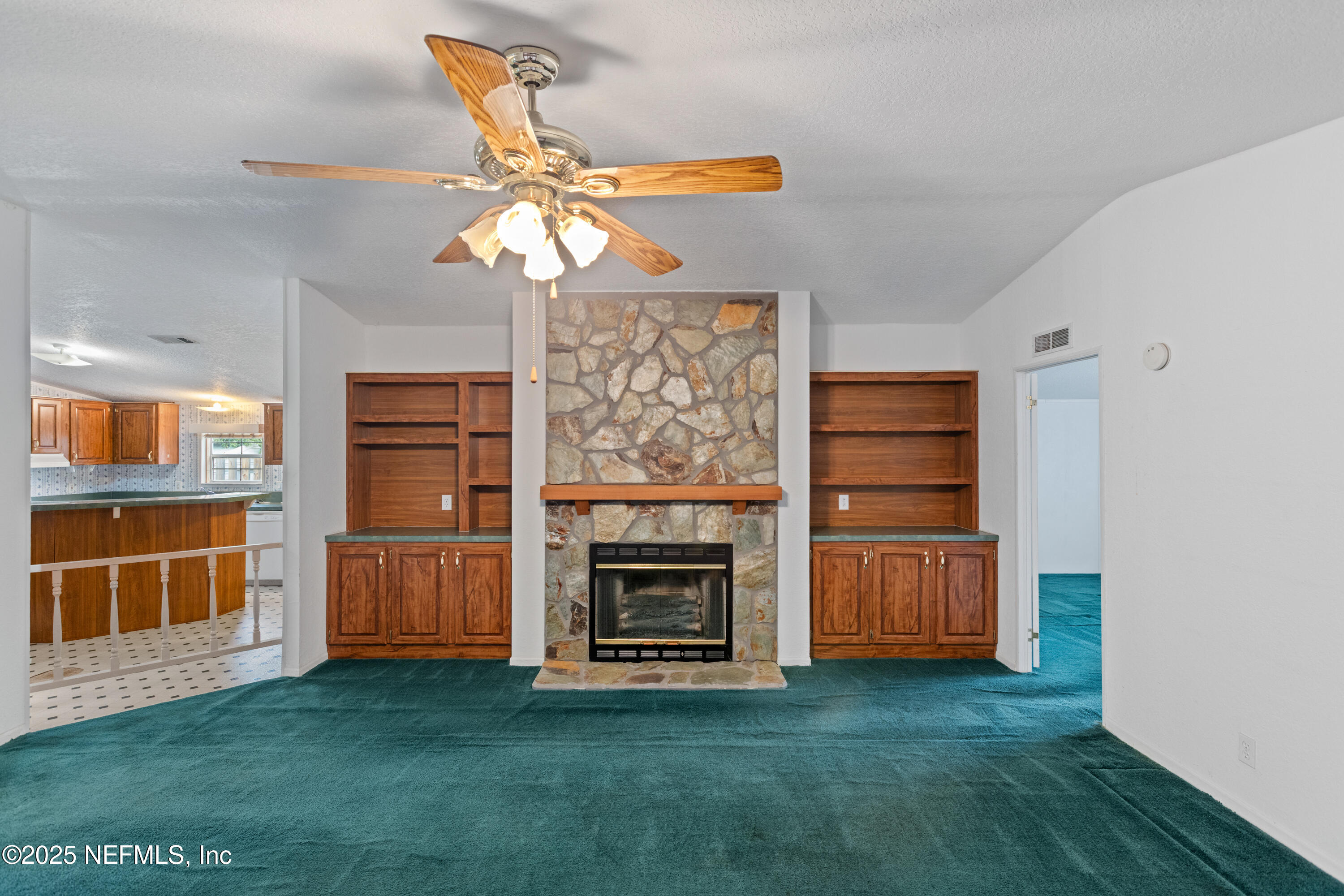 5750 Sequoia Road Keystone Heights, FL 32656 - Photo 8 of 33 a view of a livingroom with furniture and a fireplace