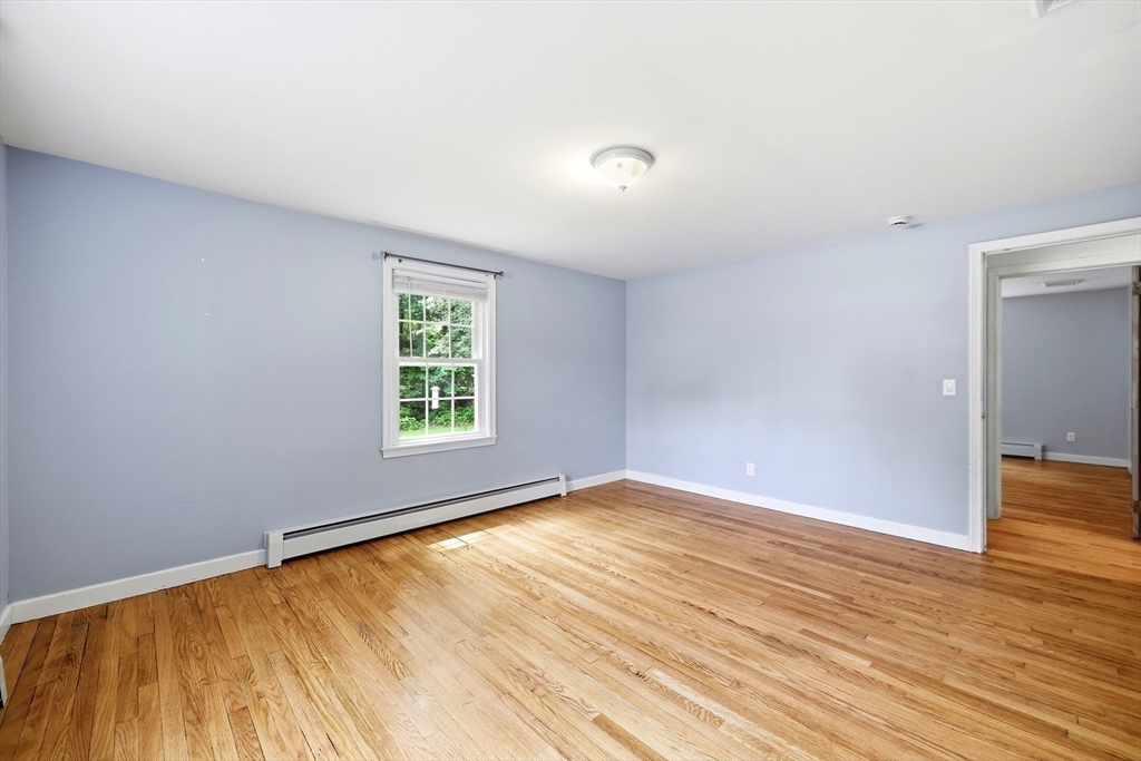 130 Connecticut Avenue Springfield, MA 01107 - Photo 33 of 40 a view of an empty room with wooden floor and a window
