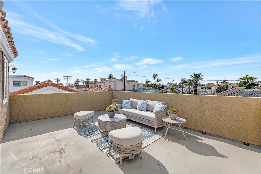 621 8th Street Huntington Beach, CA 92648 - Photo 47 of 56 a view of a terrace with furniture and a potted plant