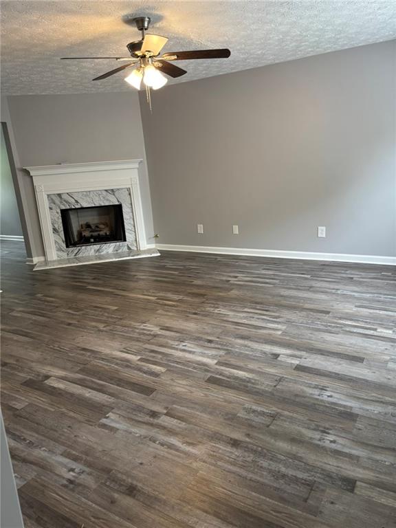 5739 Windfall Lane Lithonia, GA 30058 - Photo 4 of 36 a view of a livingroom with a fireplace a ceiling fan and wooden floor