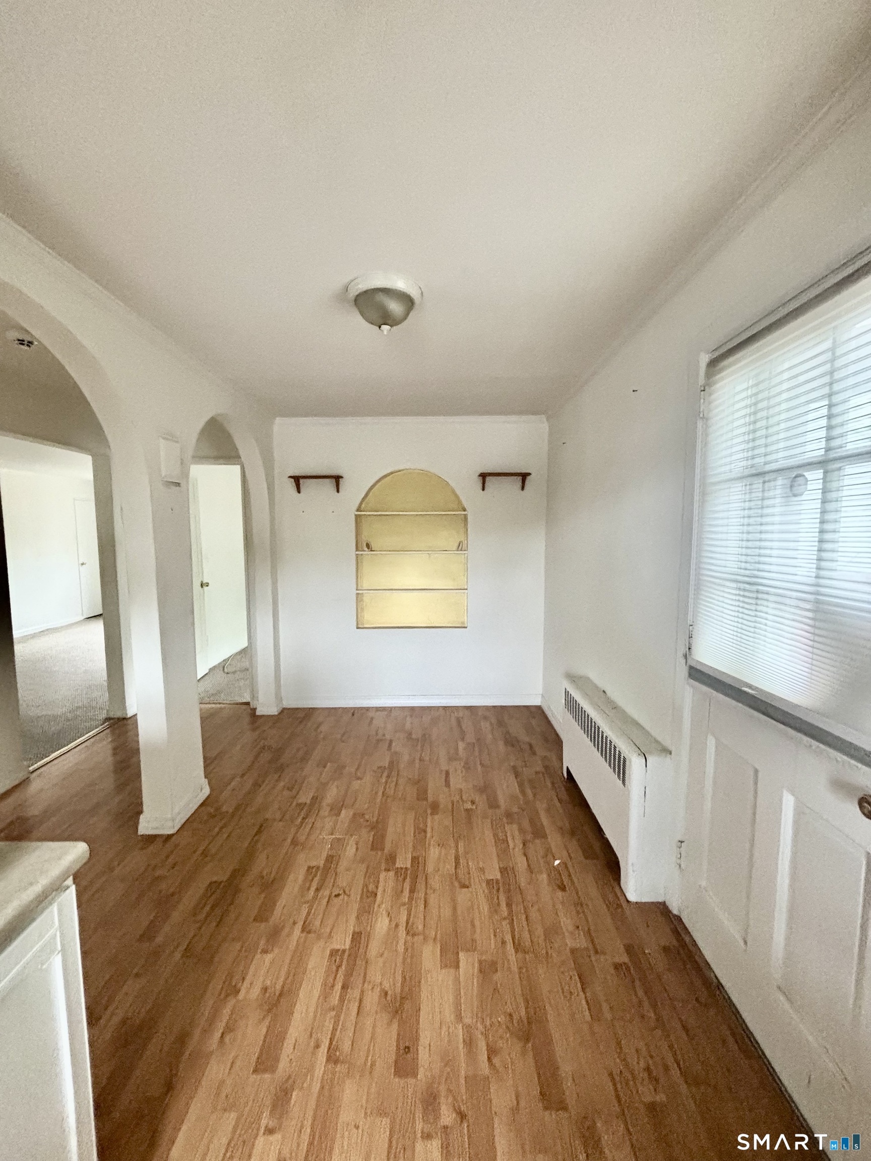 74 Standish Road, Unit 3 Stamford, CT 06902 - Photo 18 of 22 wooden floor in an empty room with a window