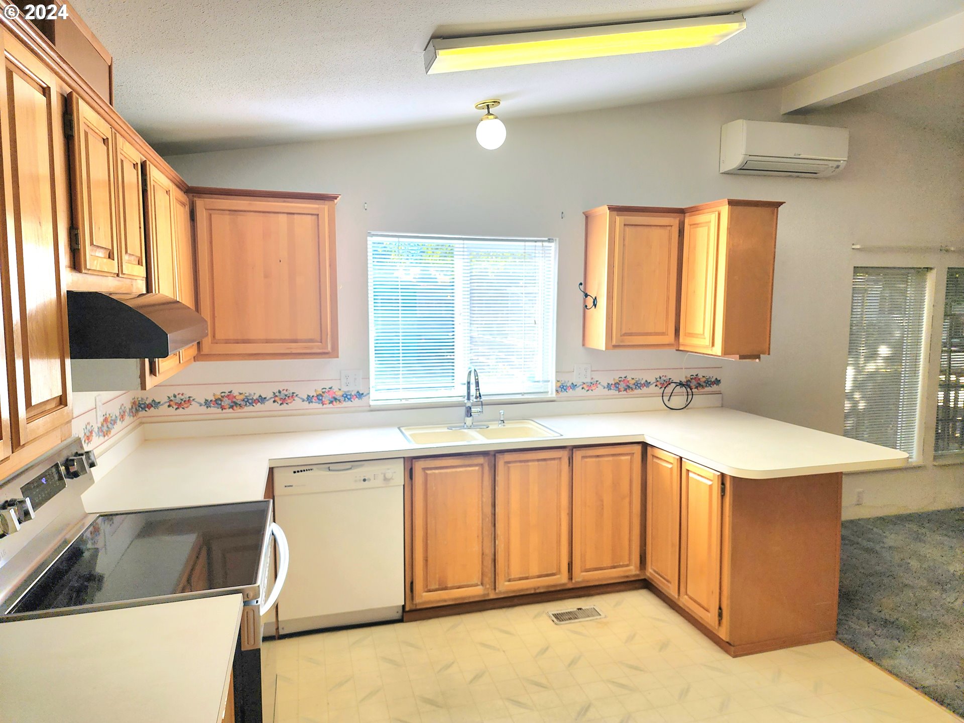 1475 Green Acres Road, Unit 69 Eugene, OR 97408 - Photo 7 of 15 a kitchen with a sink a stove and cabinets