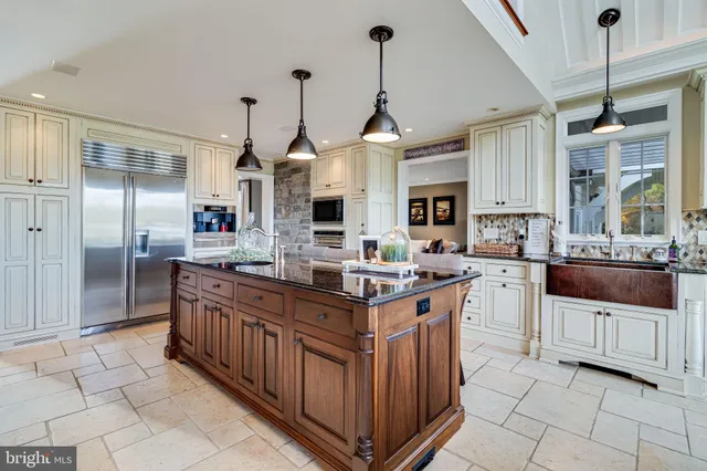 a bedroom with a bed and a flat tv screen on dresser