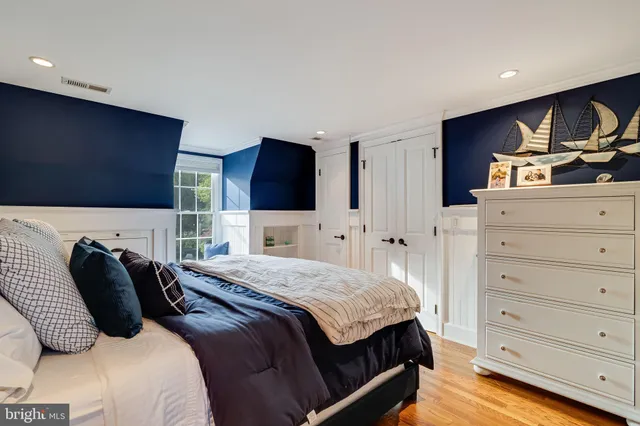 a bathroom with a sink mirror vanity and toilet