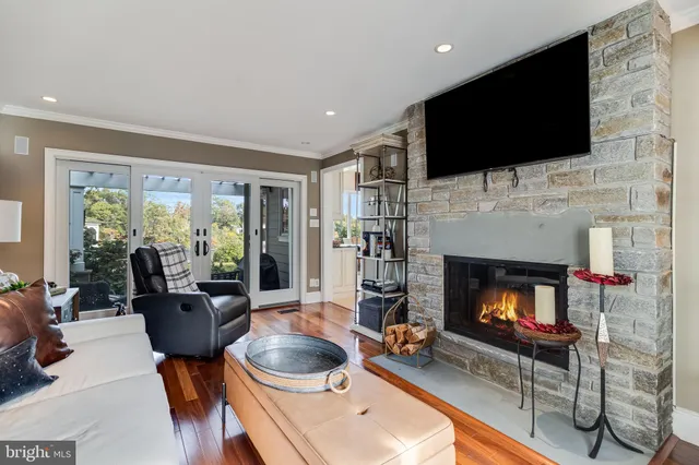 a kitchen with stainless steel appliances kitchen island granite countertop a refrigerator and a stove