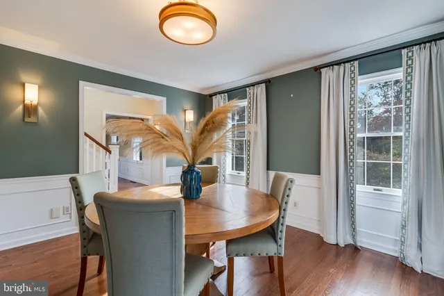 a bed room with a bed and a large window