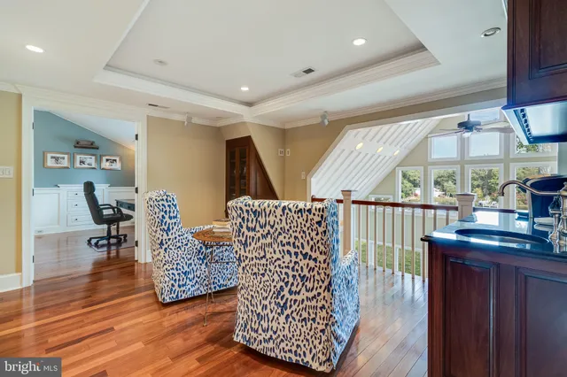 front view of a brick house with potted plants