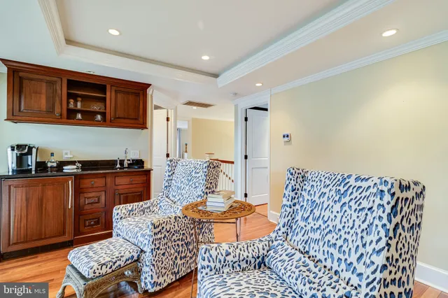 a view of a house with a big yard and large trees