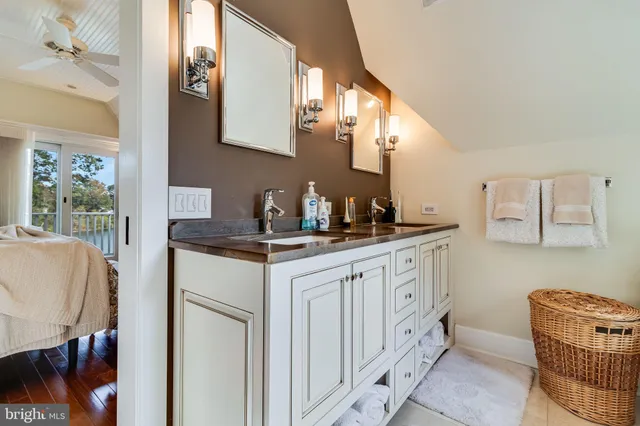 a front view of a house with a yard table and chairs