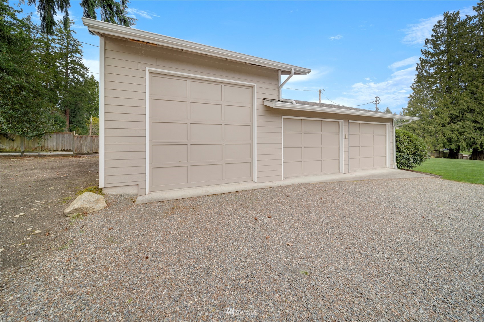 1919 Channel Road East Lake Tapps, WA 98391 - Photo 5 of 33 front view of a house with a yard